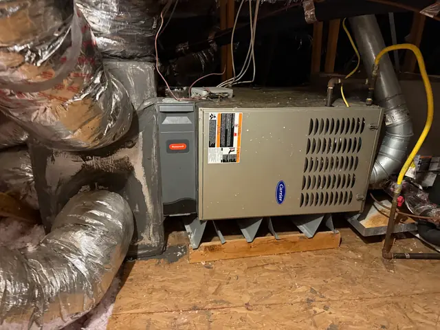 Attic furnace installation with a Honeywell control board, serviced by Prime Texas Air