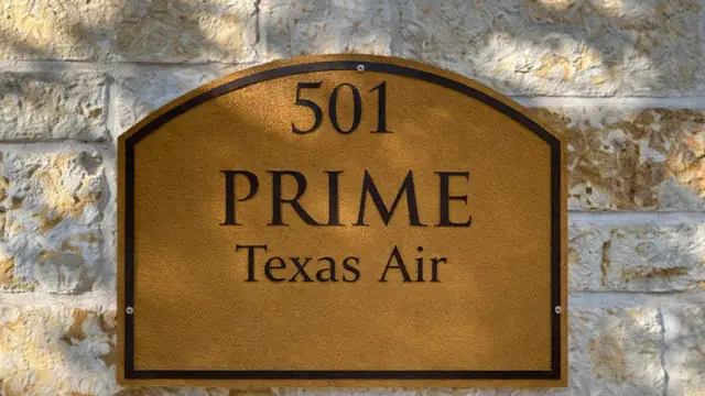 Suite door signage reading 501 Prime Texas Air at 8505 Technology Forest Pl, The Woodlands