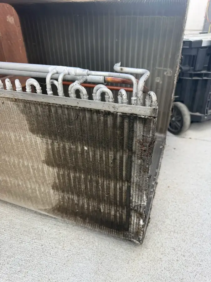 Soiled condenser coil fins before cleaning